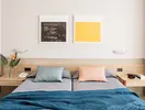 Sypialnia w hotelu Aqua Promenade z dwoma łóżkami