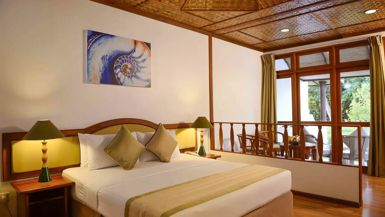 Sypialnia z dużym łóżkiem w Bandos Maldives