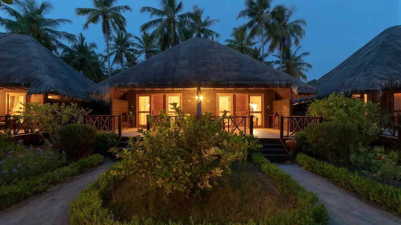 Wieczorny widok na domki w Bandos Maldives