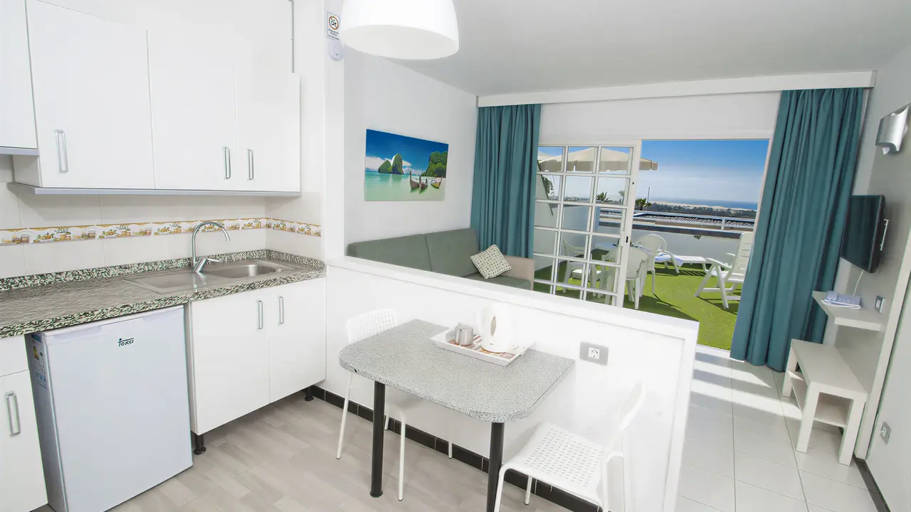 Aneks kuchenny i pokój w Bungalows Vista Oasis