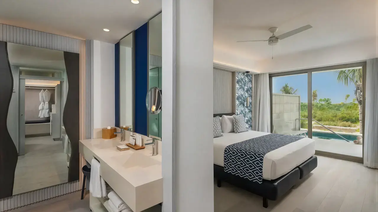 Nowoczesna sypialnia w hotelu Catalonia Grand Costa Mujeres