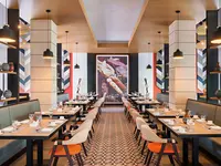 Restauracja w Catalonia Grand Costa Mujeres z ustawionymi stolikami