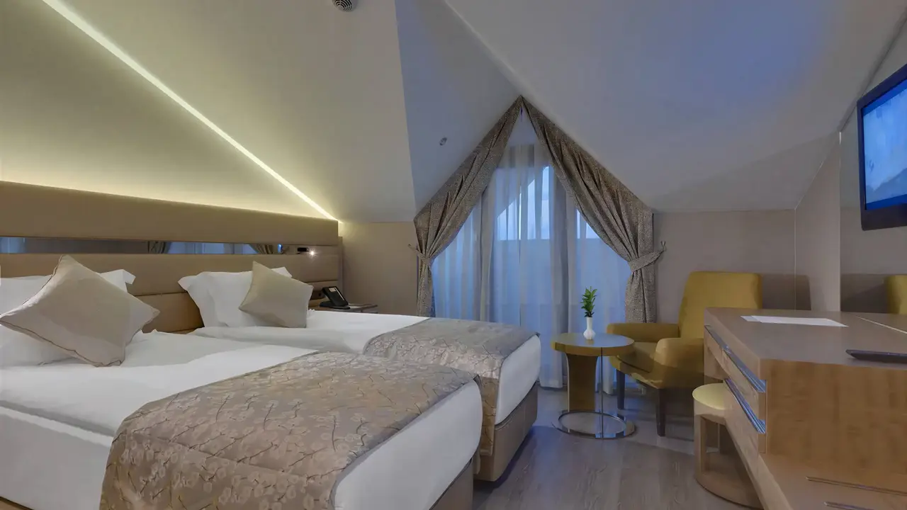Przytulny pokój z łóżkami w Club Grand Aqua