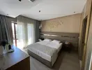 Pokój z łóżkiem w Club Grand Aqua