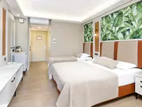 Nowoczesny pokój z łóżkami w Club Phaselis Rose