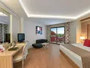 Wnętrze pokoju gościnnego w Delphin Deluxe Resort