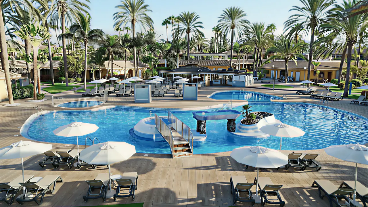 Basen z leżakami i parasolami w Dunas Suites & Villas Resort