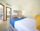 Pokój z łóżkami w hotelu Dunas Suites & Villas Resort