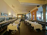 Restauracja w Europe (Davos) z nakrytymi stołami