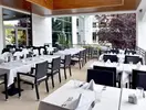 Restauracja w Flamingo Grand Hotel & Spa z nakrytymi stołami