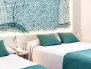 Łóżka w pokoju gościnnym w Golden Taurus Aquapark Resort
