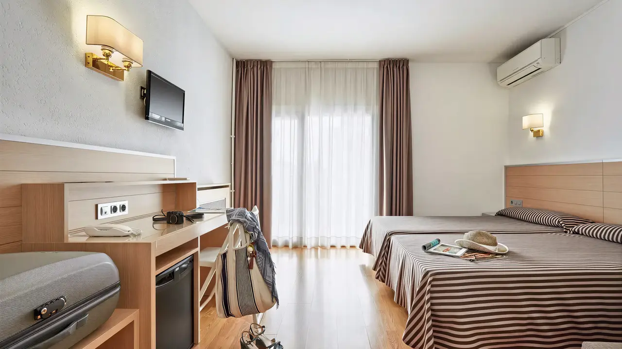 Pokój z łóżkami w Gran Hotel Flamingo