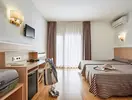 Pokój z łóżkami w Gran Hotel Flamingo