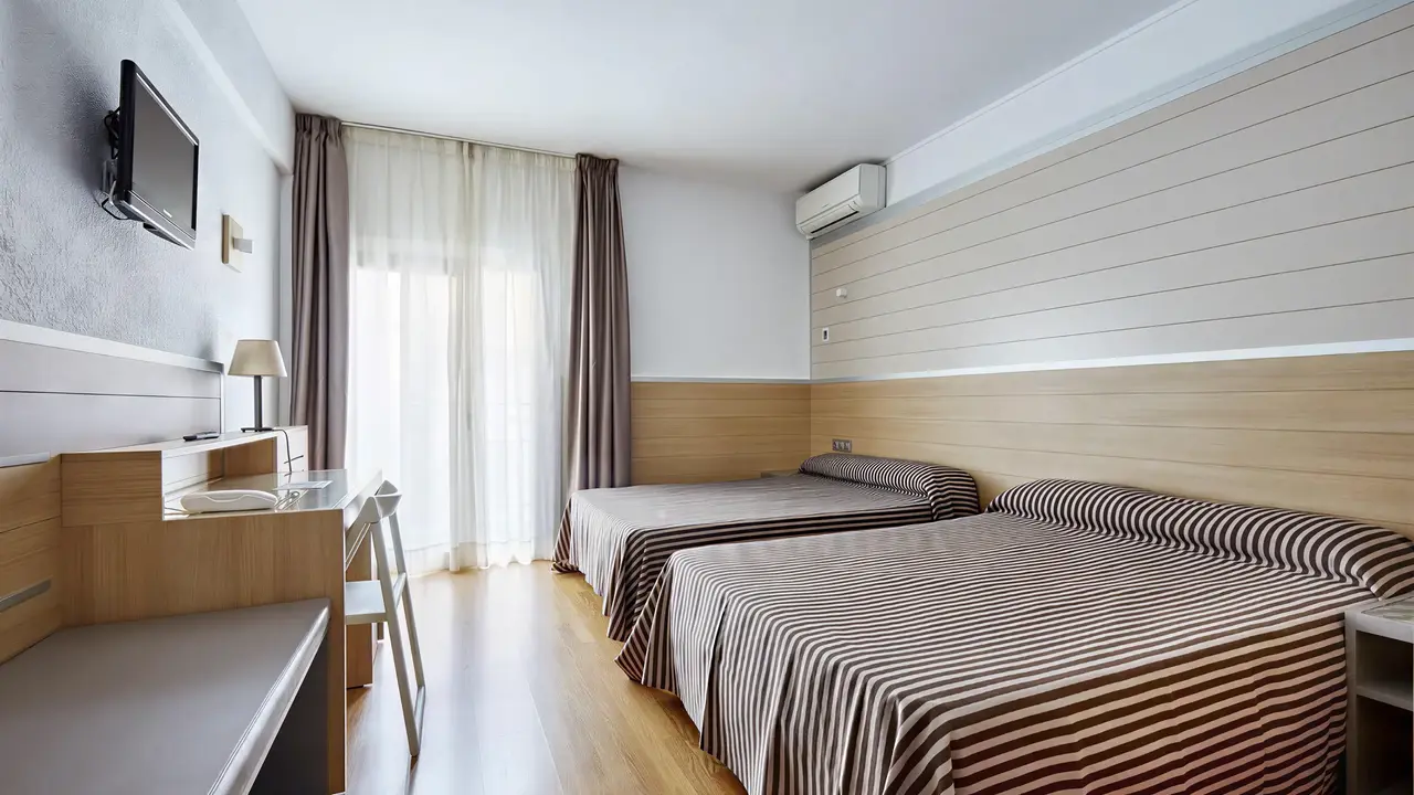 Pokój z łóżkami w Gran Hotel Flamingo