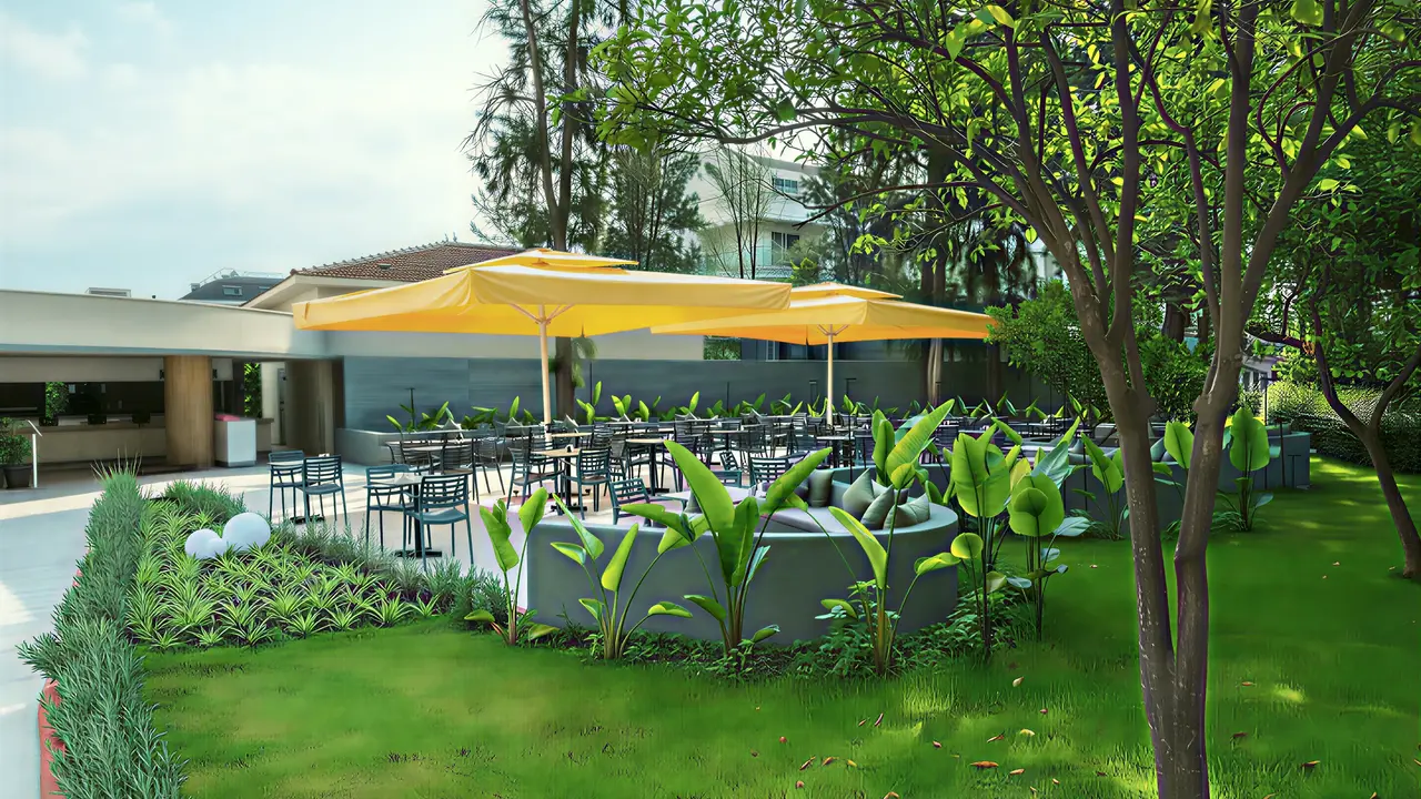 Taras z zielenią i parasolami w Greenwood Kemer Resort
