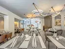 Elegancka restauracja w Grifid Aqua Club Bolero z nakrytymi stołami