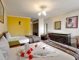 Pokój z łóżkami w hotelu Holiday Beach Club