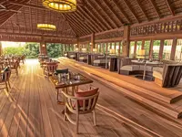 Restauracja w Hurawalhi Island Resort z drewnianym wyposażeniem