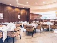 Elegancka restauracja w Iberostar Selection Kantaoui Bay z nakrytymi stołami