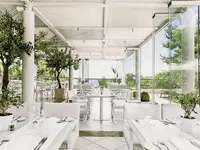 Jasna restauracja w Ikos Oceania z białymi stołami