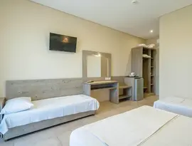 Pokój z łóżkami w hotelu Ionian Sea & Aquapark