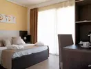 Wnętrze pokoju deluxe w La Conchiglia Suites & Spa