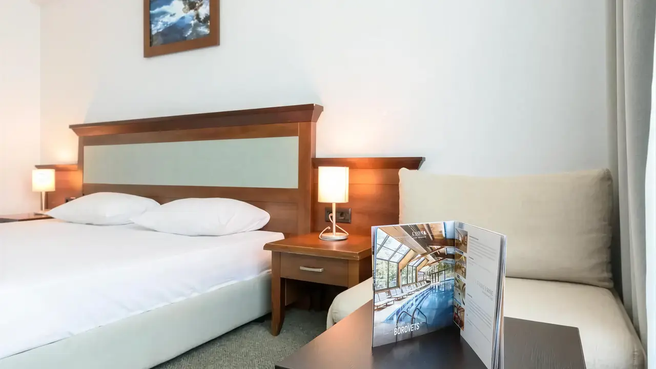 Przytulna sypialnia w hotelu Lion