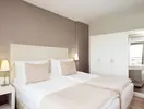 Pokój z łóżkami w hotelu Marti La Perla