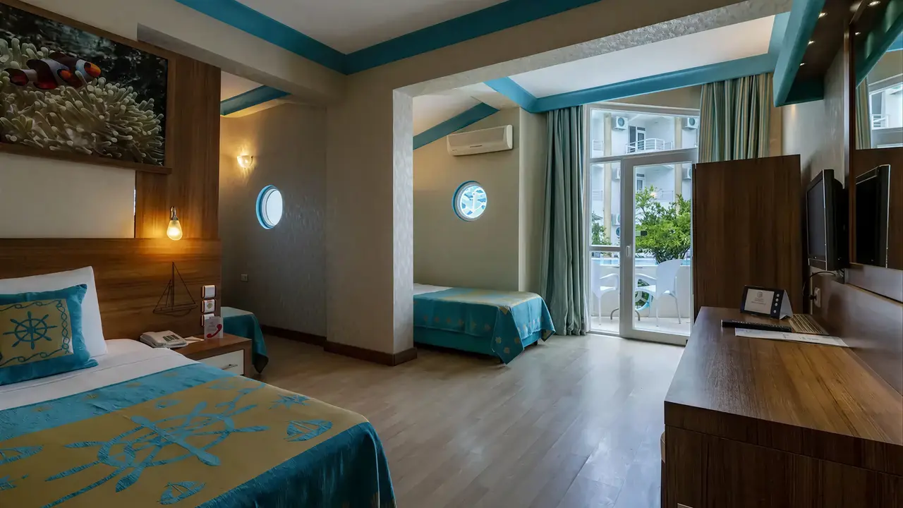 Wnętrze pokoju z łóżkami w Miarosa Kemer Beach
