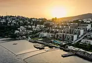 Widok na kompleks Mivara Luxury Resort & Spa Bodrum o zachodzie słońca
