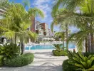 Basen i palmy w hotelu Mivara Luxury Resort & Spa Bodrum