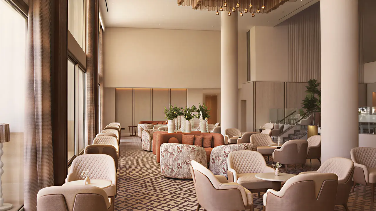Elegancki salon z wygodnymi fotelami w Olympic Lagoon Resort Paphos