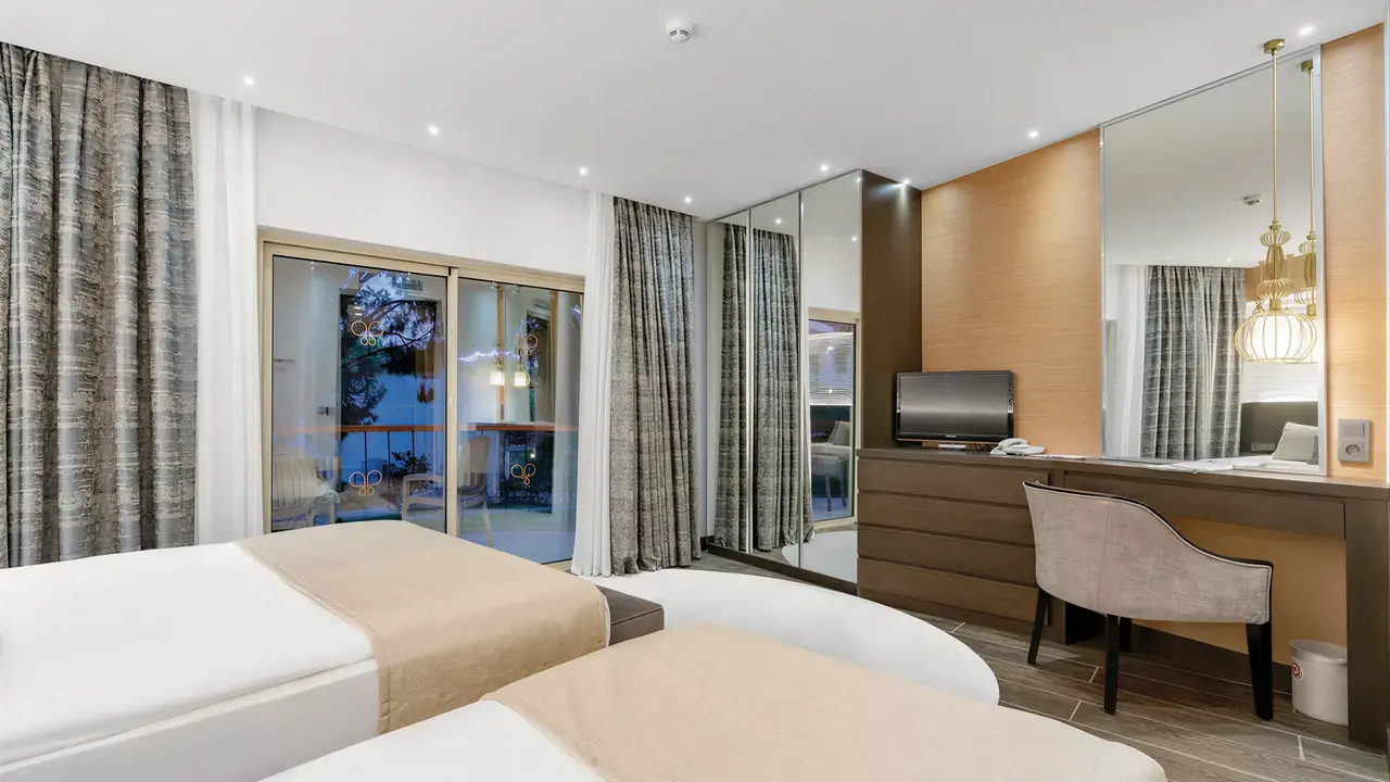 Pokój z łóżkami w hotelu Papillon Belvil