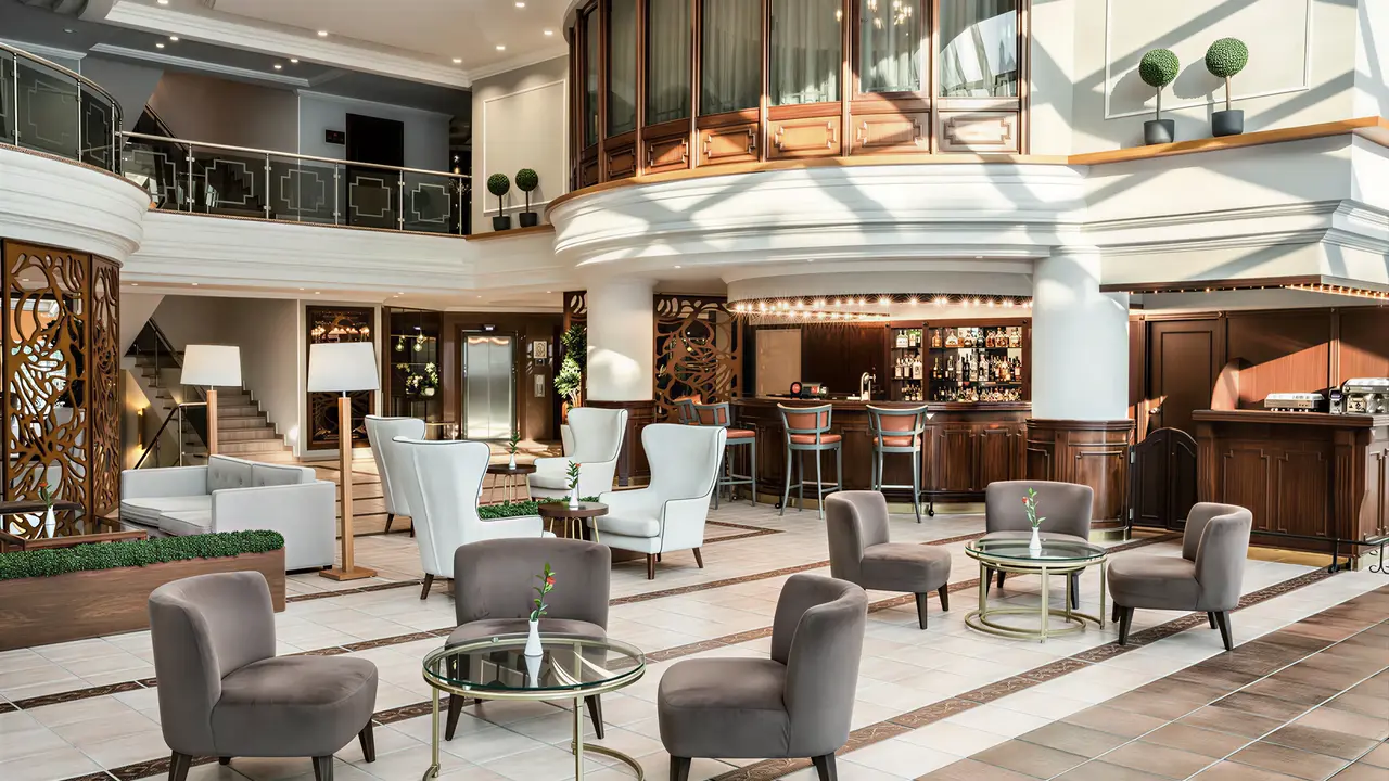 Elegancki lobby z wygodnymi fotelami w Papillon Belvil