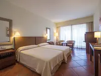 Pokój z łóżkami w Puerto Antilla Grand