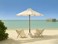 Leżaki i parasol na plaży w Sirru Fen Fushi Private Lagoon Resort