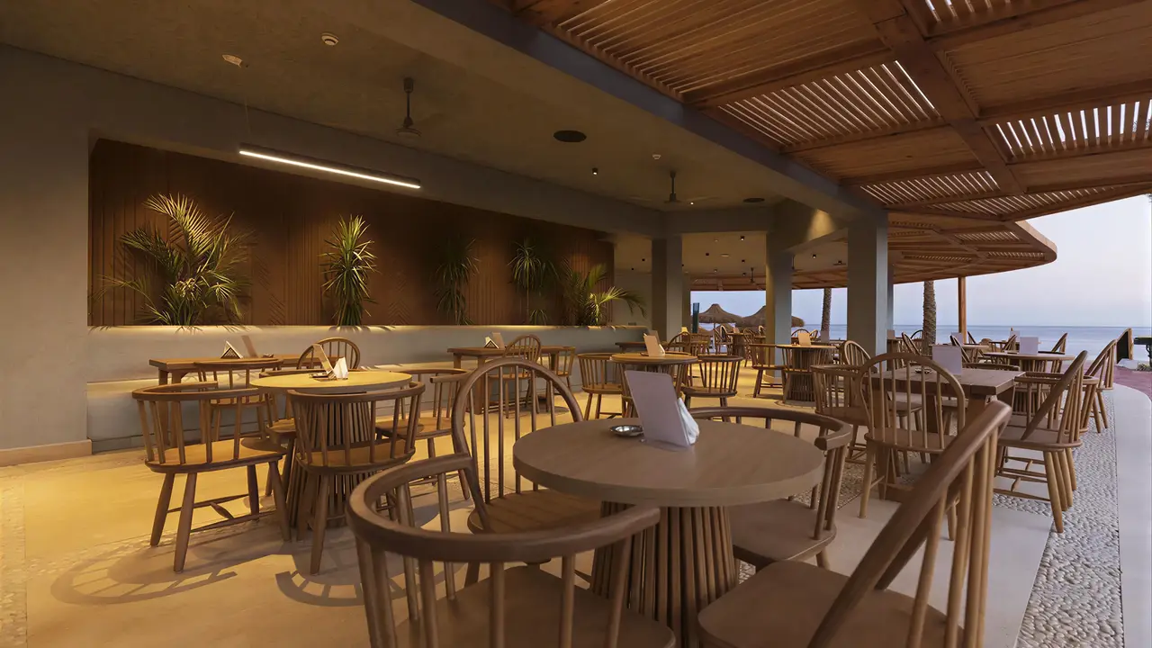 Restauracja w Sunrise Remal Beach z drewnianymi meblami