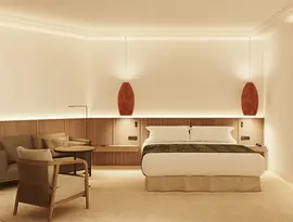 Nowoczesny pokój z łóżkiem w Tivoli La Caleta Resort