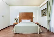 Sypialnia z dużym łóżkiem w Xenios Anastasia Resort