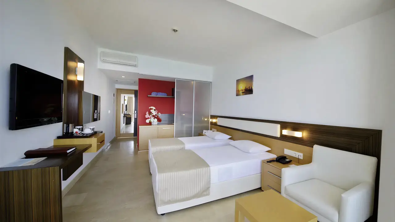 Pokój z łóżkami w hotelu Yalihan Una