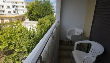 International (Kos)